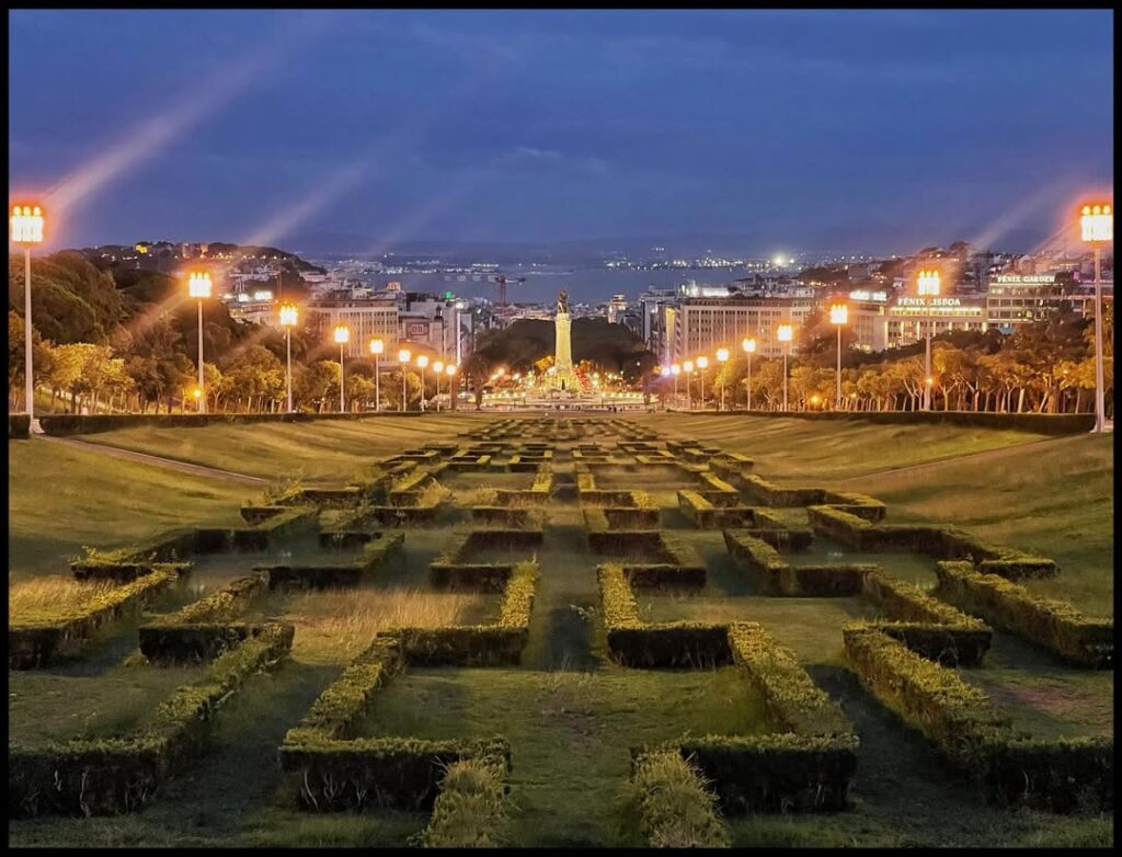 Parking in Lisbon: Apps, Prices + Where to Park 4 Beautiful view of Lisbon's city park illuminated with streetlights during the evening.