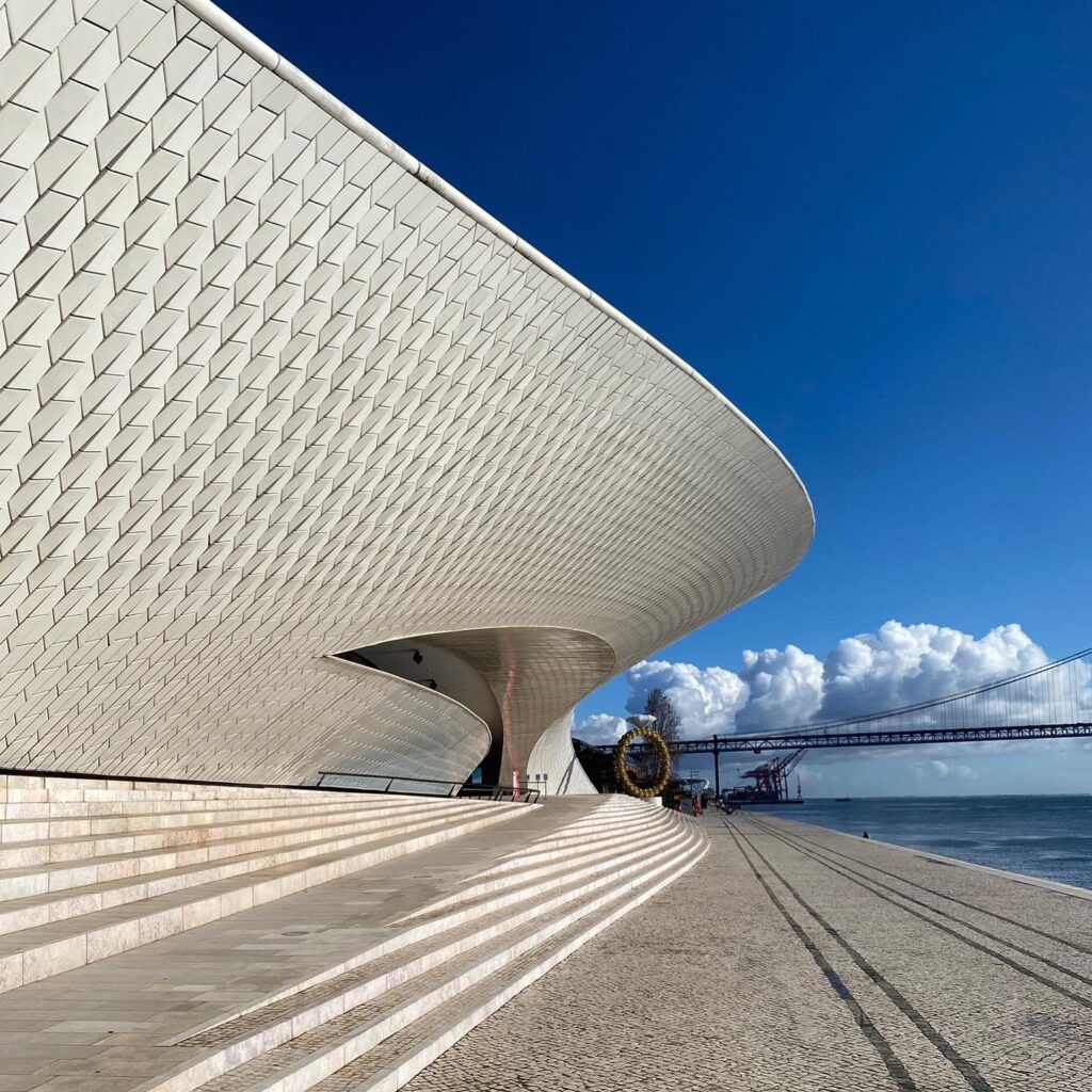 Lisbon in March: 10 Things To Do (Spring is Here) 8 Contemporary architectural building in Lisbon with sleek white design and waterfront views, perfect for spring visits.