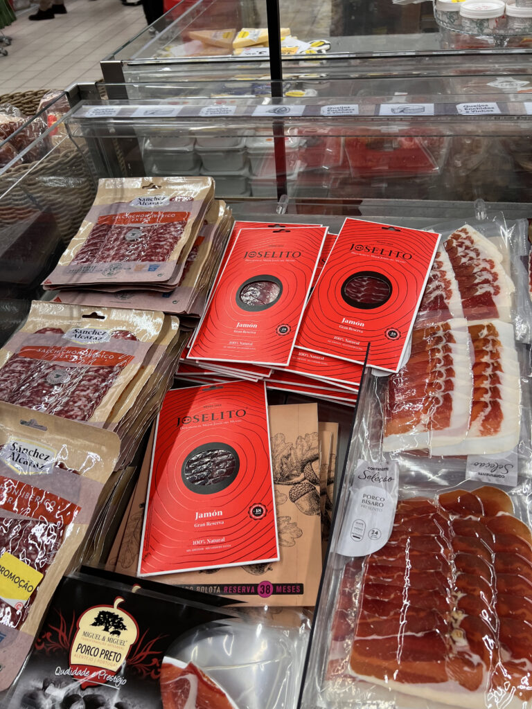 Supermarkets in Lisbon: Where Locals Actually Shop 2 Up of packaged meats and cured ham at a Lisbon supermarket, showcasing local shopping options for fresh and traditional products.