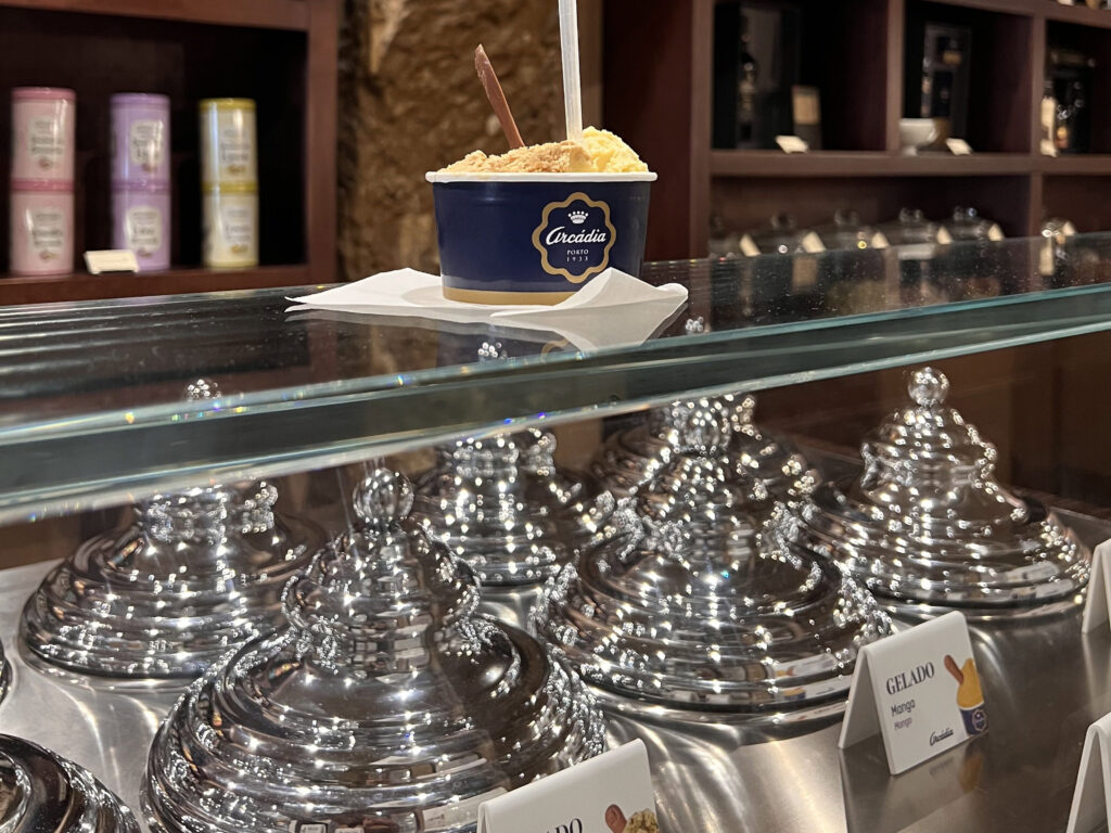 Lisbon Food Guide: What to Eat + Where to Eat (Local Tips + Map) 10 Rich, creamy gelato in a cozy Lisbon ice cream shop, showcasing authentic Portuguese desserts perfect for travelers exploring LisboaVibes and enjoying the best local flavors.