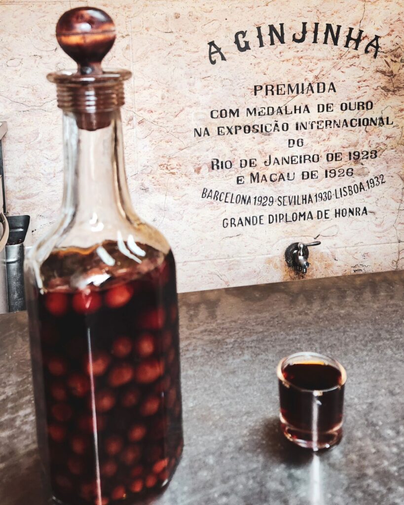 Lisbon Bucket List: 15 Must-Try Things in Lisbon 15 ginjinha in bottle and glass