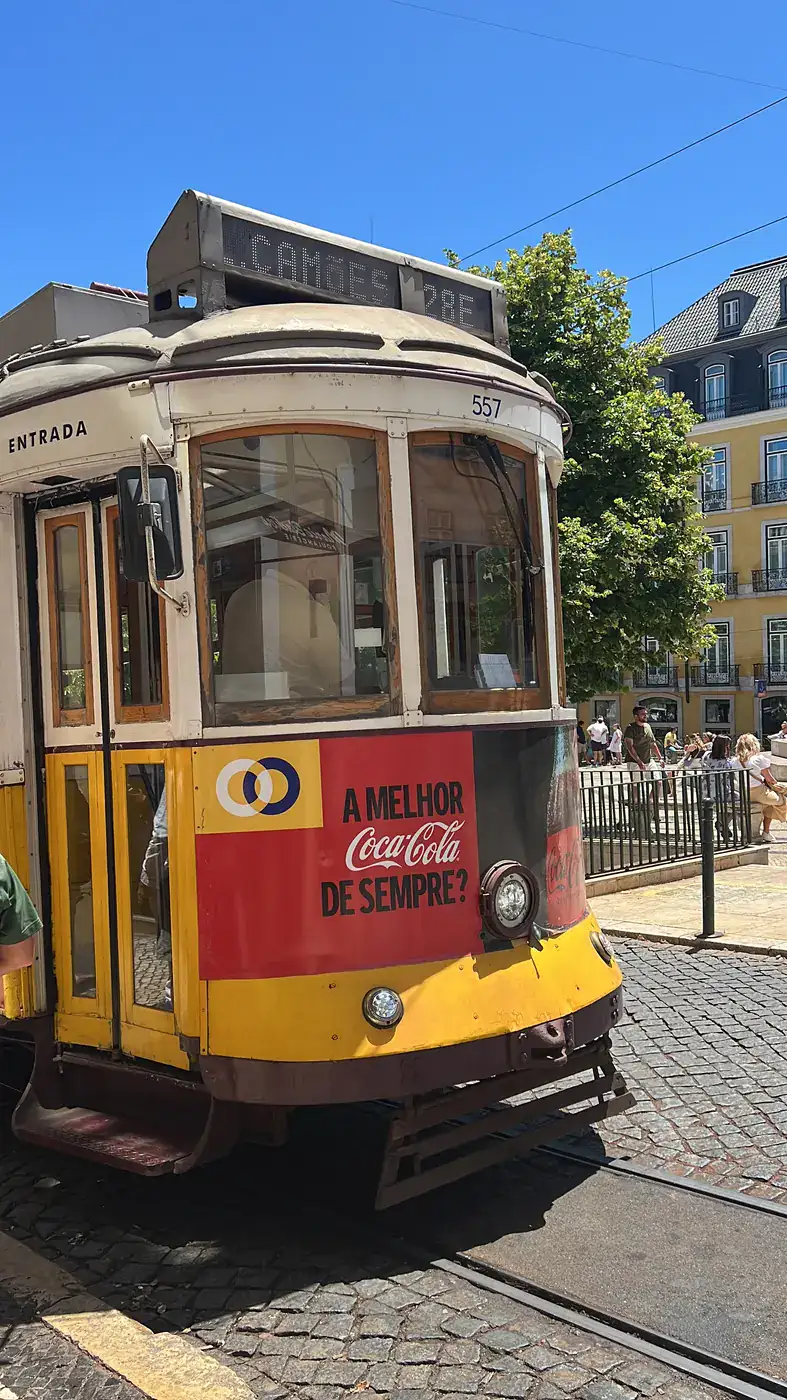 Plan Your Trip To Lisbon 1 Tram 28 climbing a street in Lisbon
